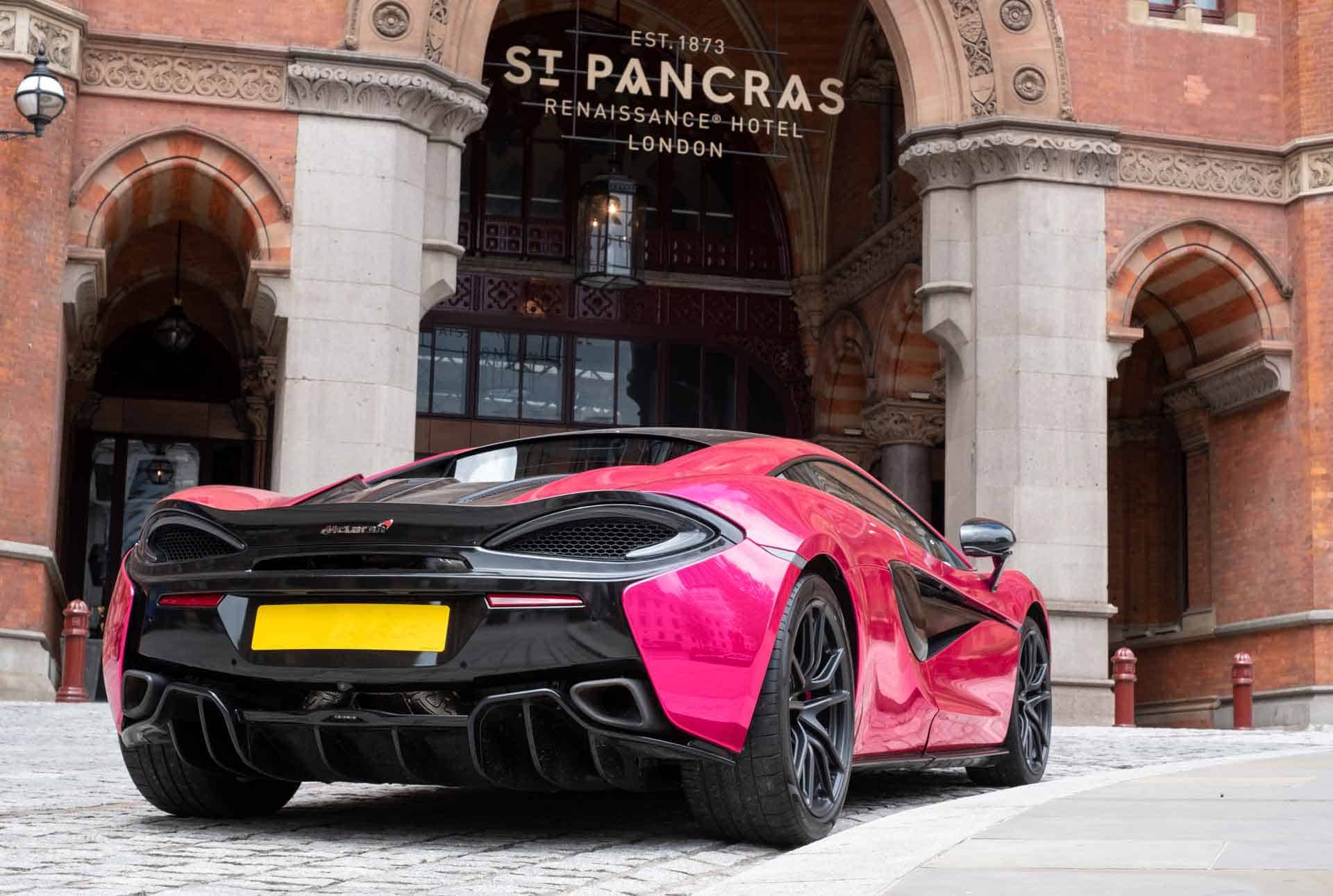 London Uk Bright Pink Mclaren Luxury Racing Car Parked Outside The St Pancras Renaissance Hotel In Kings Cross Central London Photo By Lois Gobe